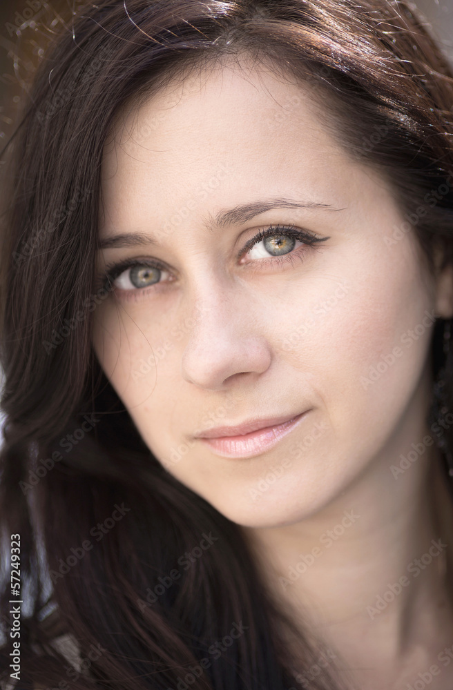 Close-up portrait of beautiful young woman. Close-up portrait of beautiful young woman.