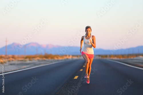 Running woman sprinting on road highway
