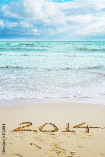 Beautiful view on the beach with 2014 year signs