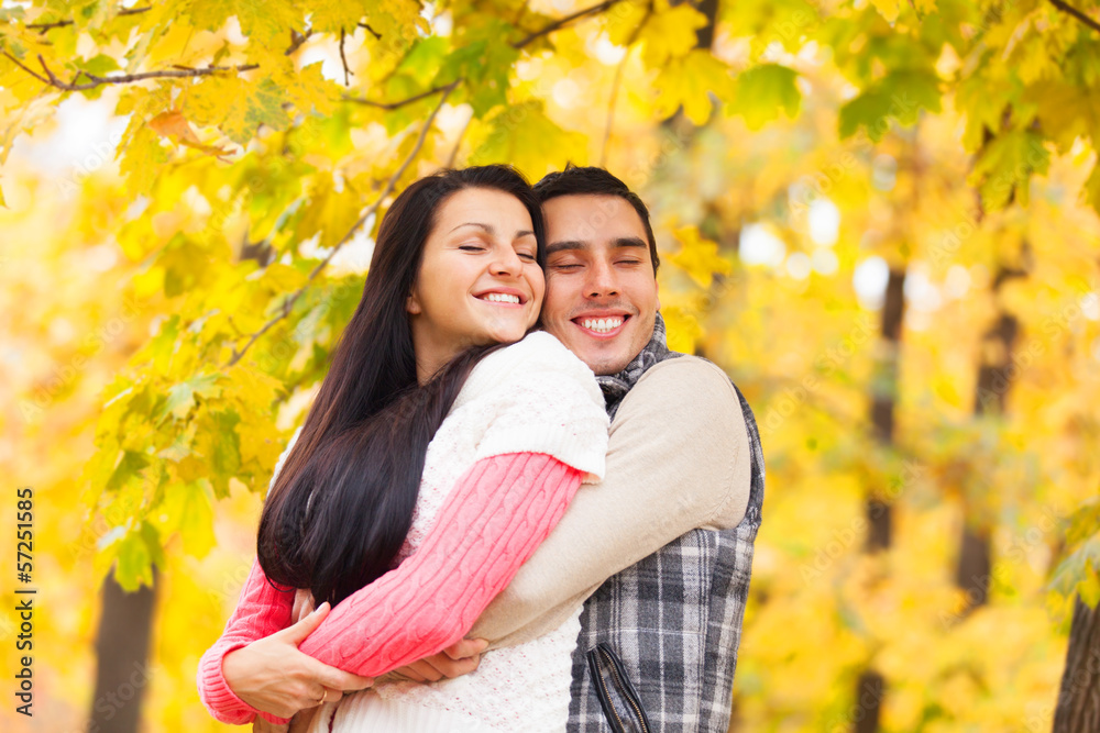 Teen couple at the park in autumn time Teen couple at the park in autumn time