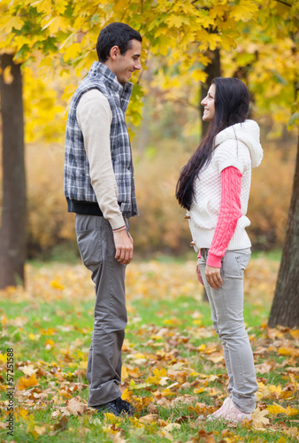 Teen couple at the park in autumn time