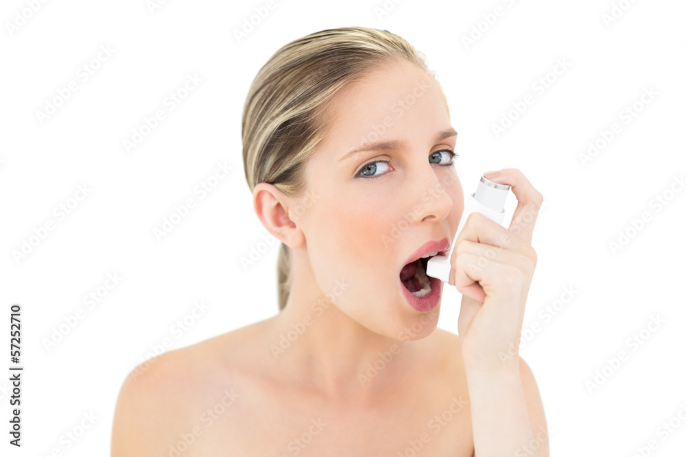 Natural fresh blonde woman using asthma inhaler Natural fresh blonde woman using asthma inhaler