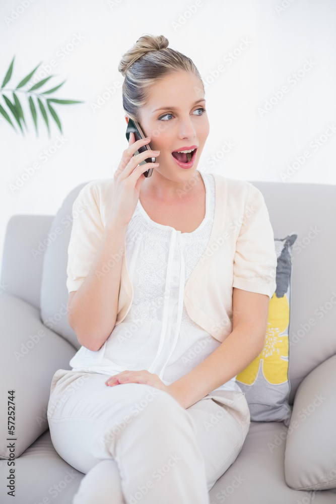 Surprised fresh model in white clothes having a call Surprised fresh model in white clothes having a call
