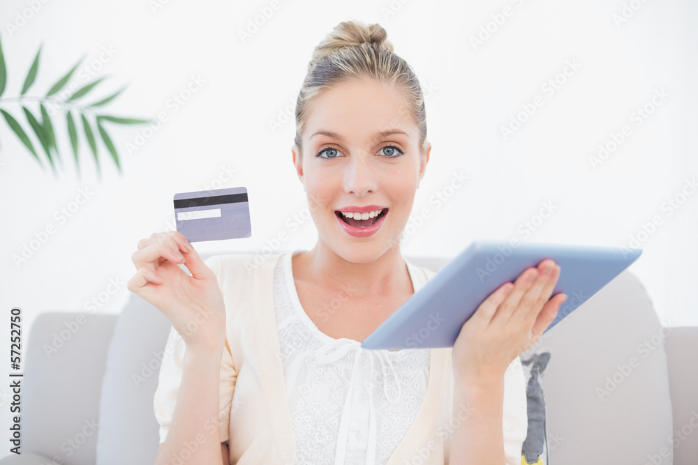 Surprised gorgeous model in white clothes shopping online Surprised gorgeous model in white clothes shopping online