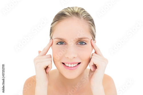 Foto Happy fresh blonde woman touching her temples