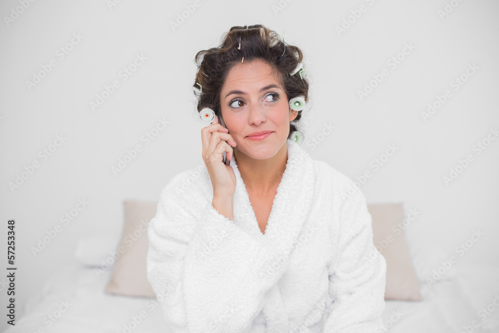 Thoughtful natural brunette phoning