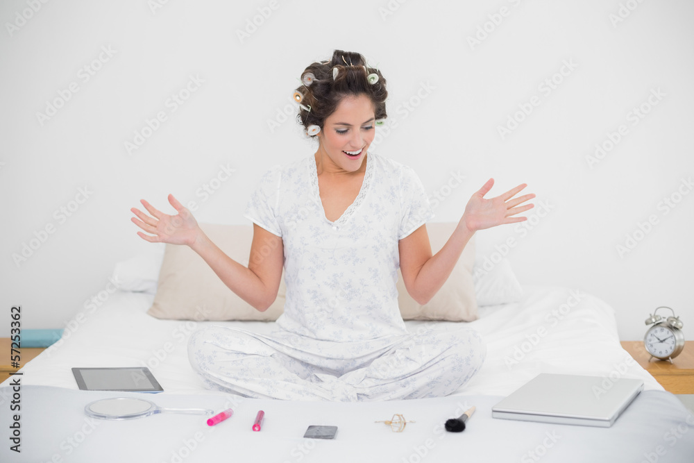 Surprised natural brunette sitting in lotus pose Surprised natural brunette sitting in lotus pose
