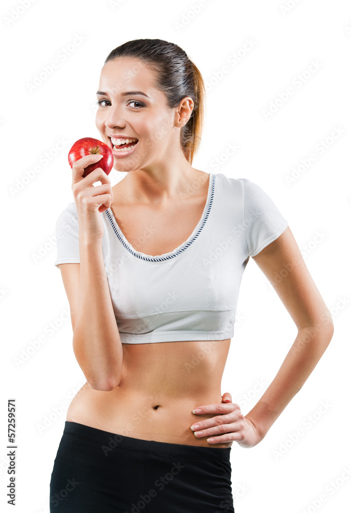 Beautiful fit woman holding an apple