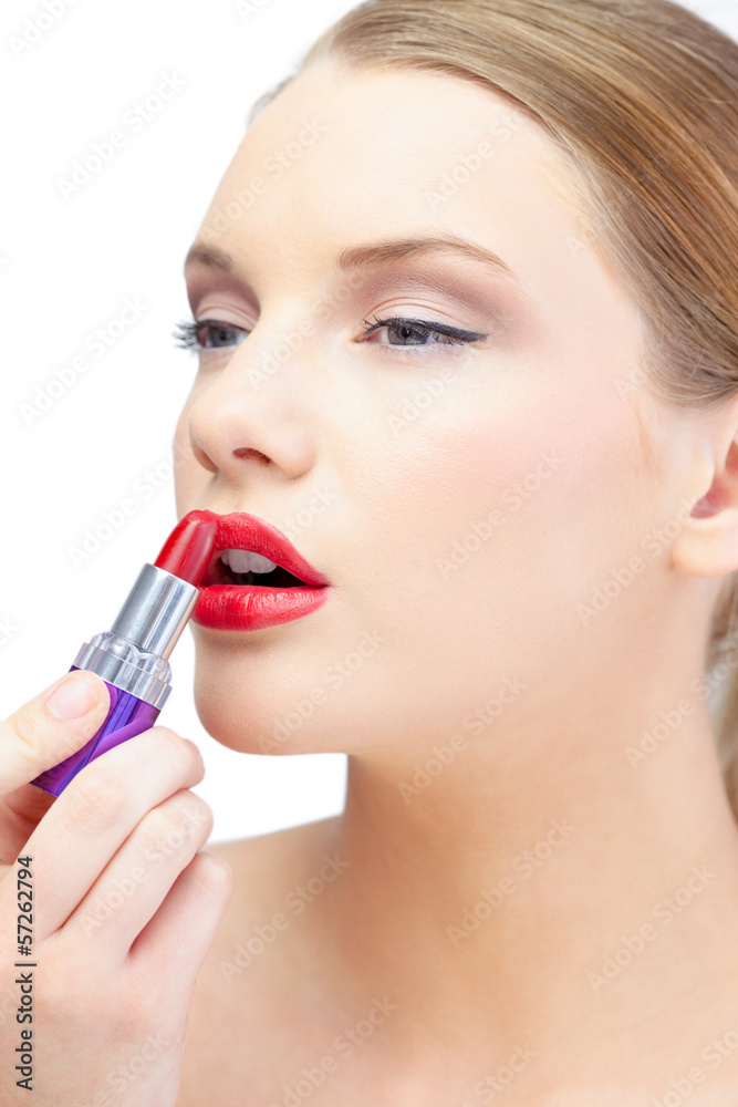 Glamorous blonde applying red lipstick Glamorous blonde applying red lipstick