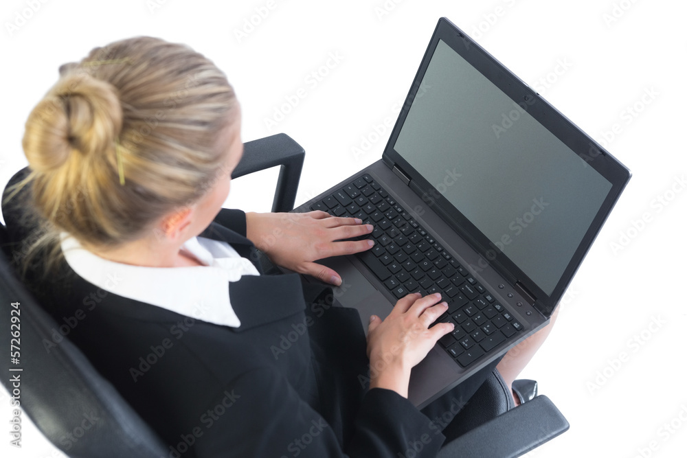 Well dressed businesswoman sitting concentrated on her office ch Well dressed businesswoman sitting concentrated on her office ch