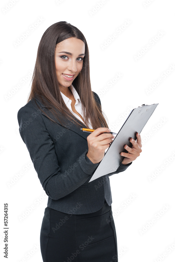 business woman writing something down on the plane table. business woman writing something down on the plane table.
