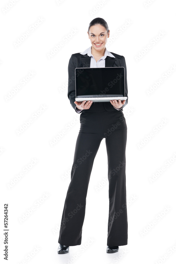 Smiling businesswoman holding computer in her hand Smiling businesswoman holding computer in her hand