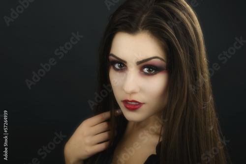 beautiful woman with halloween makeup isolated on black backgrou