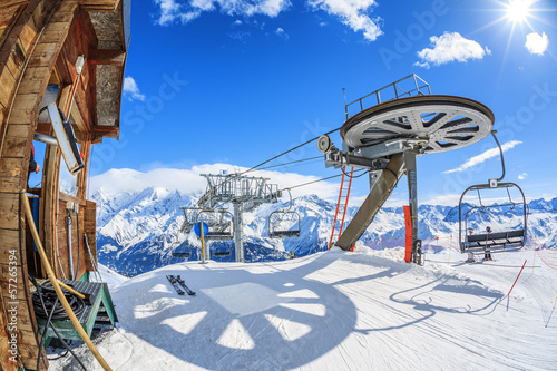 Ski lift chairs and sun