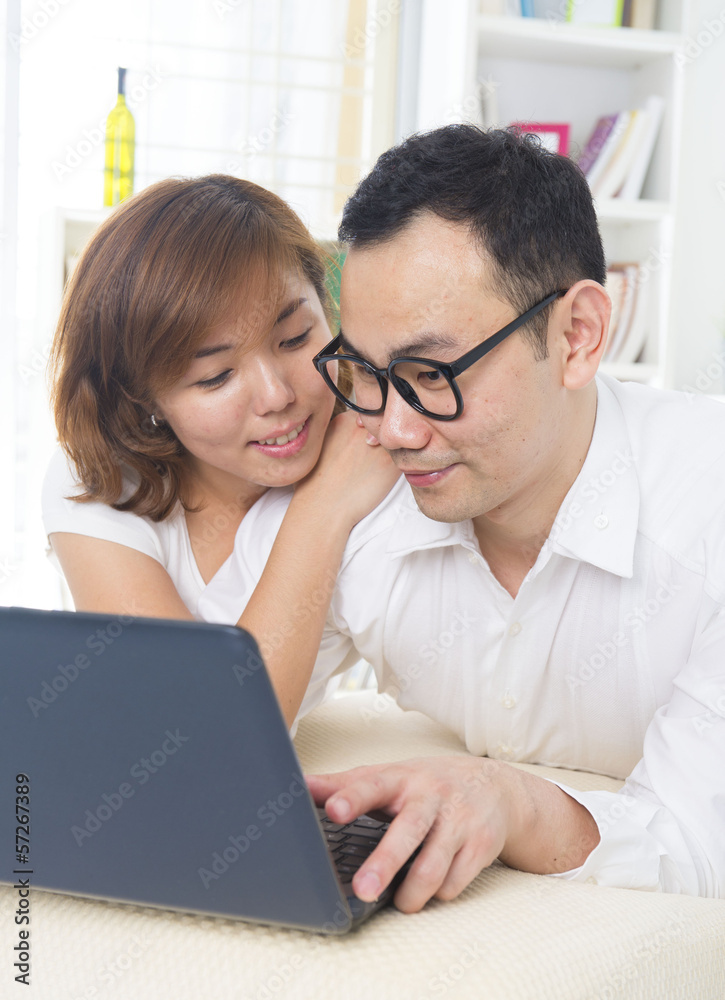 Young Asian couple using tablet Young Asian couple using tablet