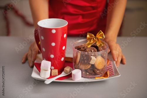 Closeup on plate with christmas cookies and cup of hot chocolate