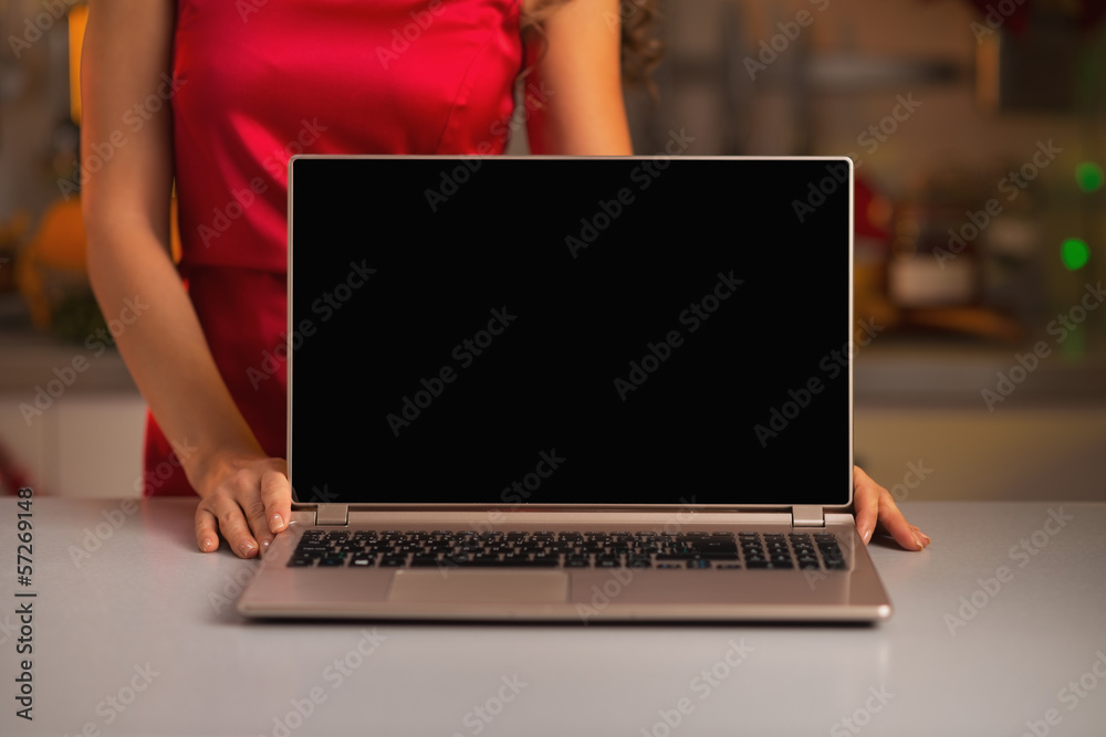 Fototapeta premium Closeup on laptop blank screen showing by woman in red dress 