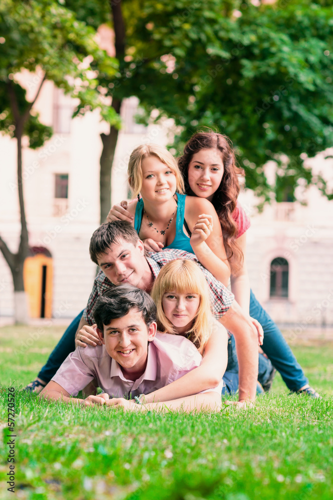 Group of happy smiling Teenage Students Outside Group of happy smiling Teenage Students Outside