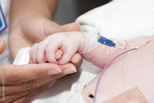 Newborn and hand