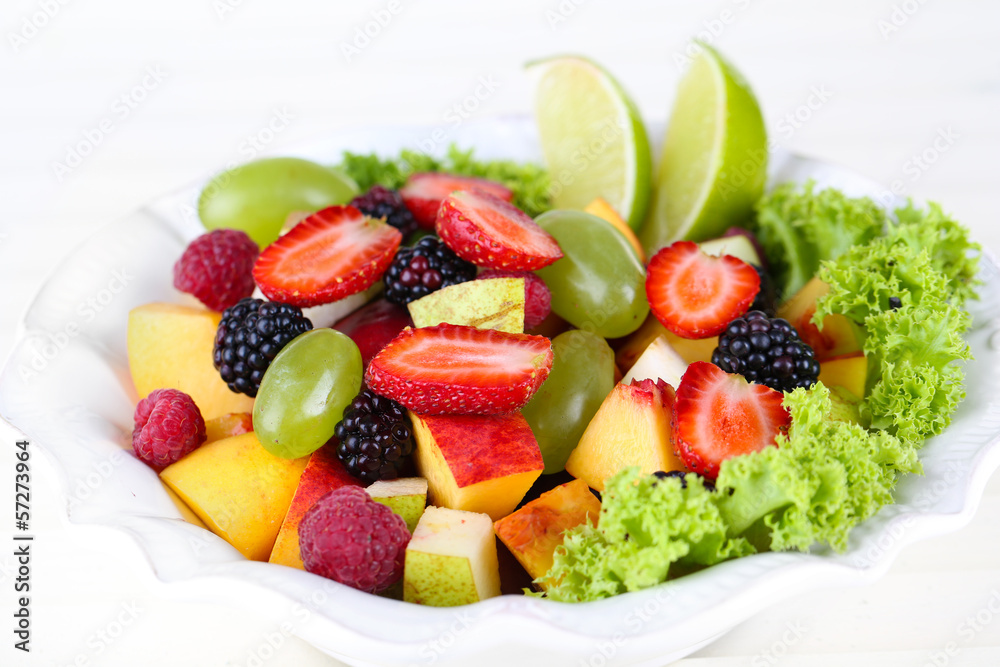 Fruit salad in plate isolated on white Fruit salad in plate isolated on white