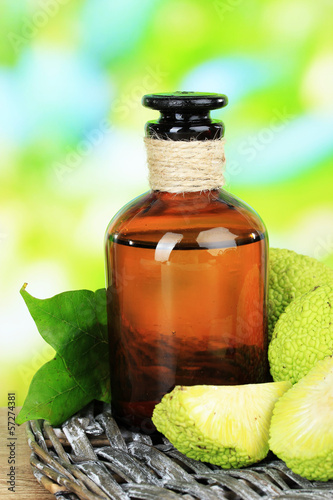 Osage Orange fruits (Maclura pomifera) and medicine bottle, photo