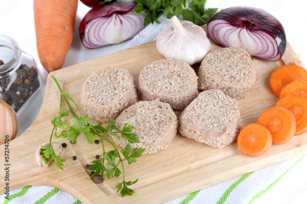 Meat patties on board on napkin isolated on white Meat patties on board on napkin isolated on white
