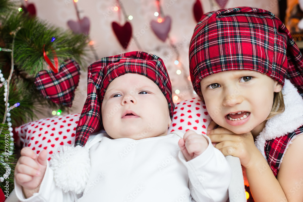 TWo kids in santa's hat TWo kids in santa's hat