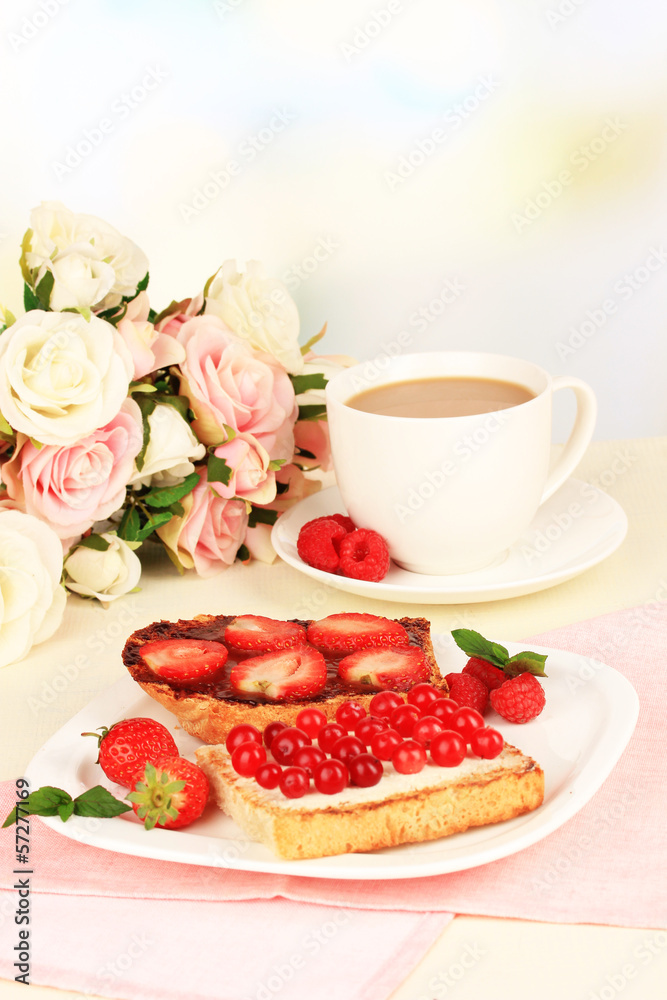 Delicious toast with berries on table close-up