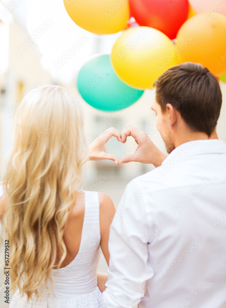 couple with colorful balloons couple with colorful balloons