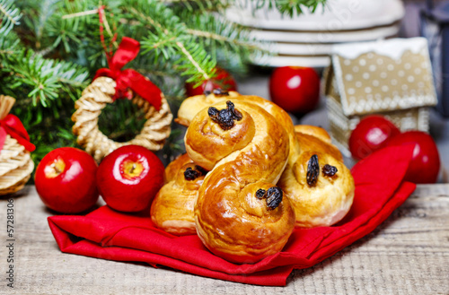 Traditional swedish buns in christmas setting. A saffron bun photo