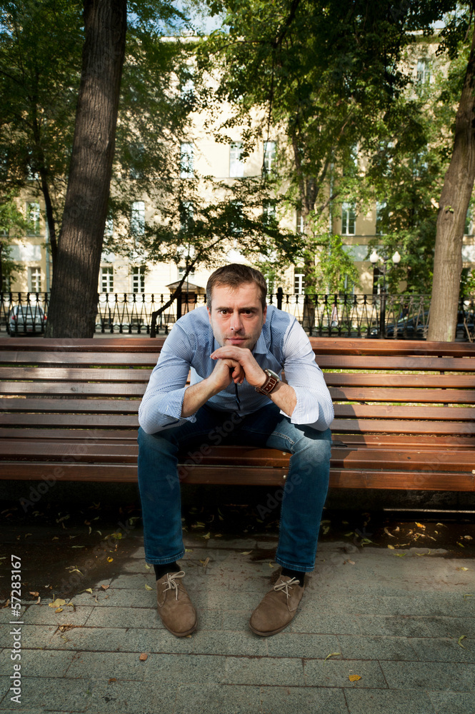 Fototapeta premium Man relaxing in the public garden