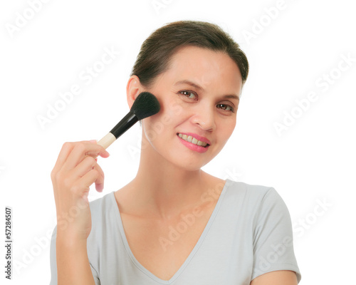 Middle age asian woman with make up brush.