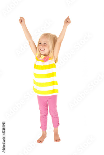Young girl celebrating raising arms in the air