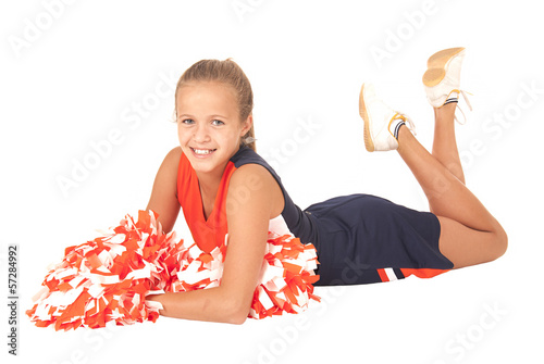 Fotografija Young high school cheerleader laying down with pom poms