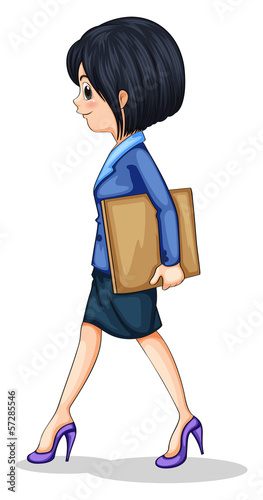 A businesswoman walking while holding the documents