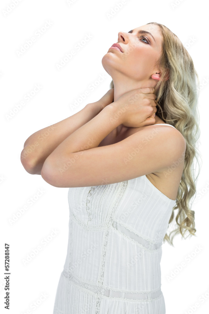 Fototapeta premium Thoughtful sensual blonde holding her neck
