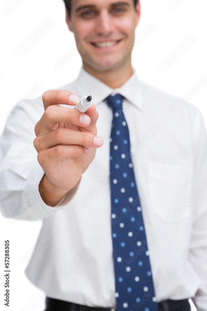 Smiling businessman holding marker Smiling businessman holding marker