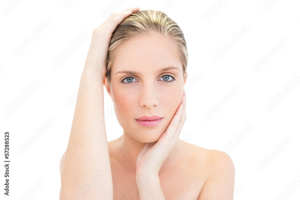 Relaxed fresh blonde woman holding her head Relaxed fresh blonde woman holding her head