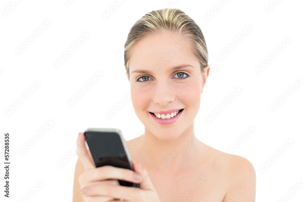 Content fresh blonde woman using her mobile phone Content fresh blonde woman using her mobile phone