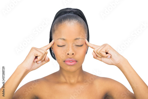Foto Woman with closed eyes pointing on her head