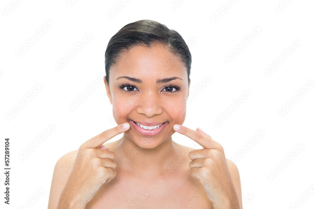Content young dark haired model pointing her cheeks with her fin Content young dark haired model pointing her cheeks with her fin