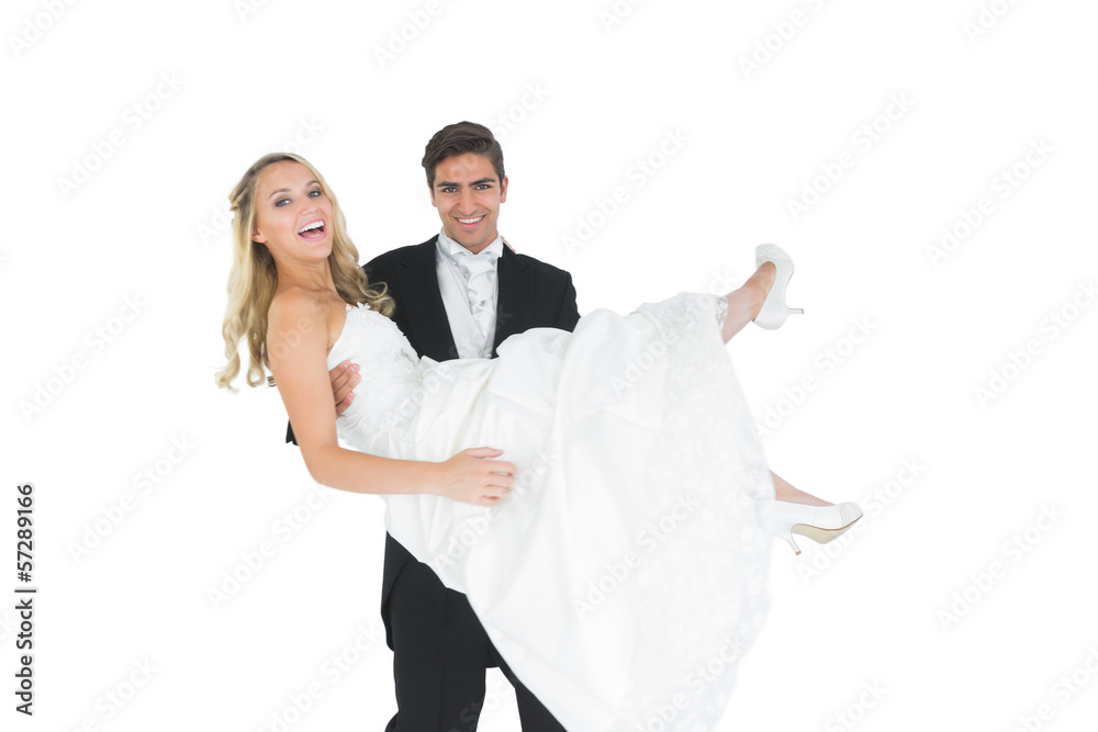 Smiling bridegroom lifting his wife up Smiling bridegroom lifting his wife up