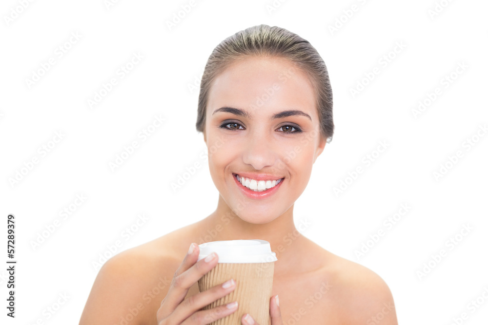 Cheerful brunette woman holding a cup of coffee Cheerful brunette woman holding a cup of coffee