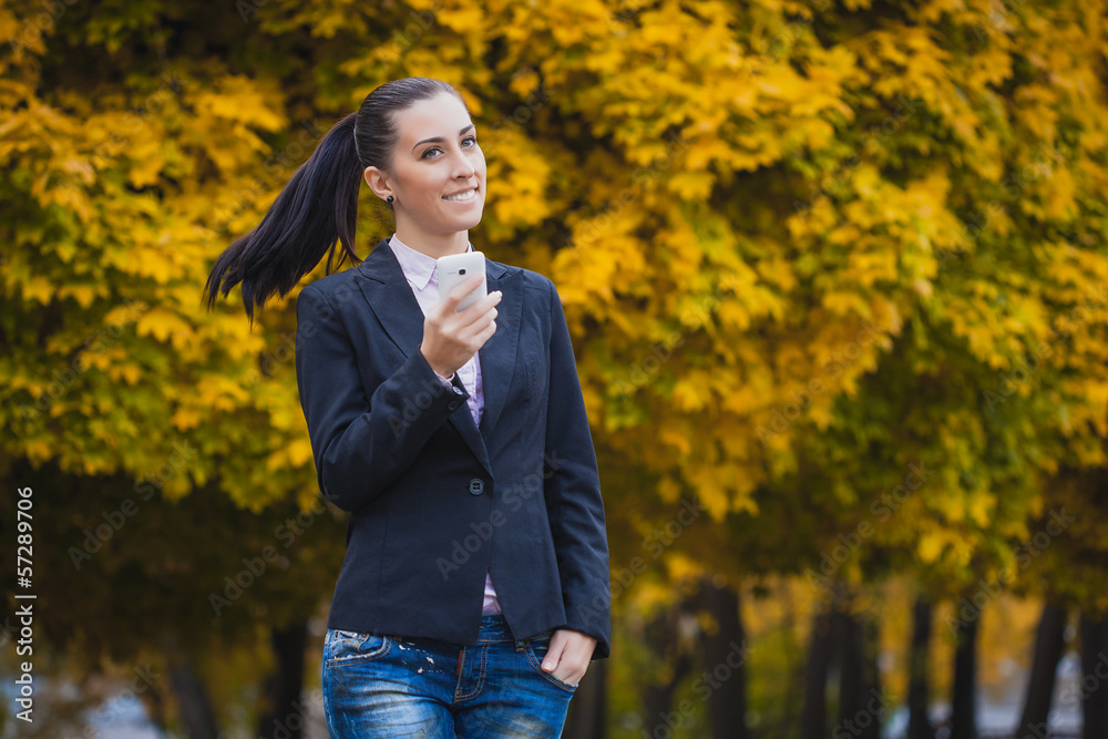woman, on the autumn trees background woman, on the autumn trees background