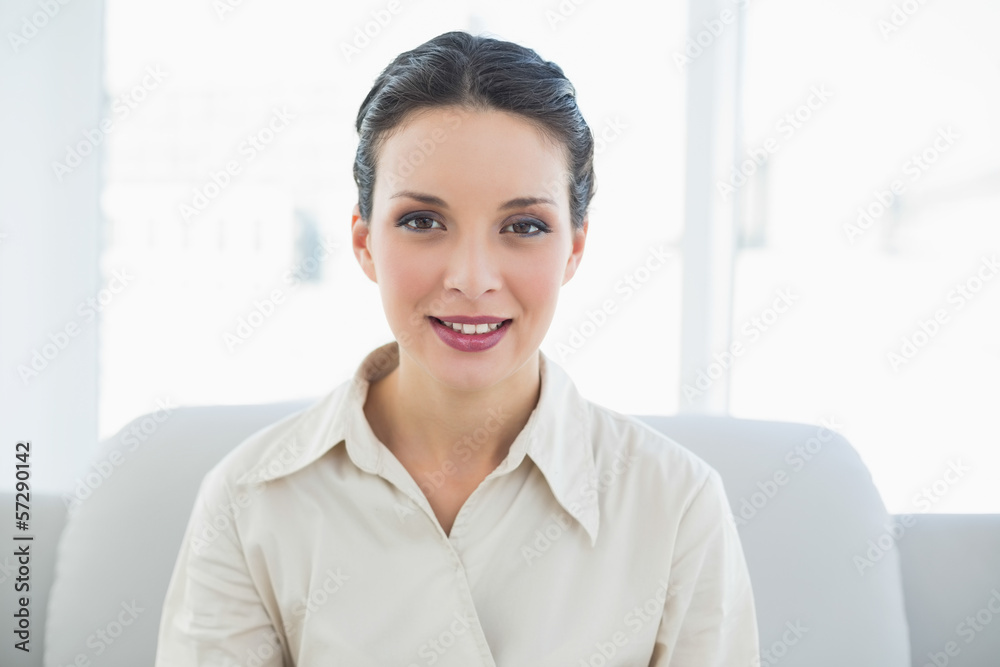 Relaxed stylish brunette businesswoman posing looking at camera Relaxed stylish brunette businesswoman posing looking at camera