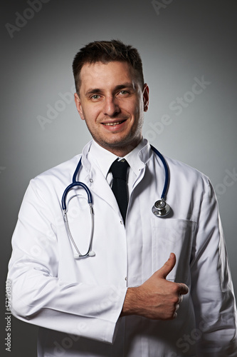 Medical doctor with thumb up