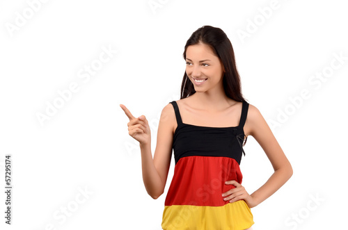 Girl pointing to the side.Young woman with Germany flag blouse