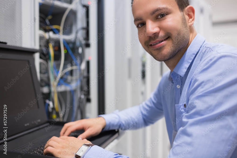 Man searching through servers Man searching through servers