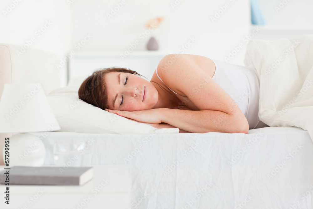 Lovely brunette woman having a rest while lying