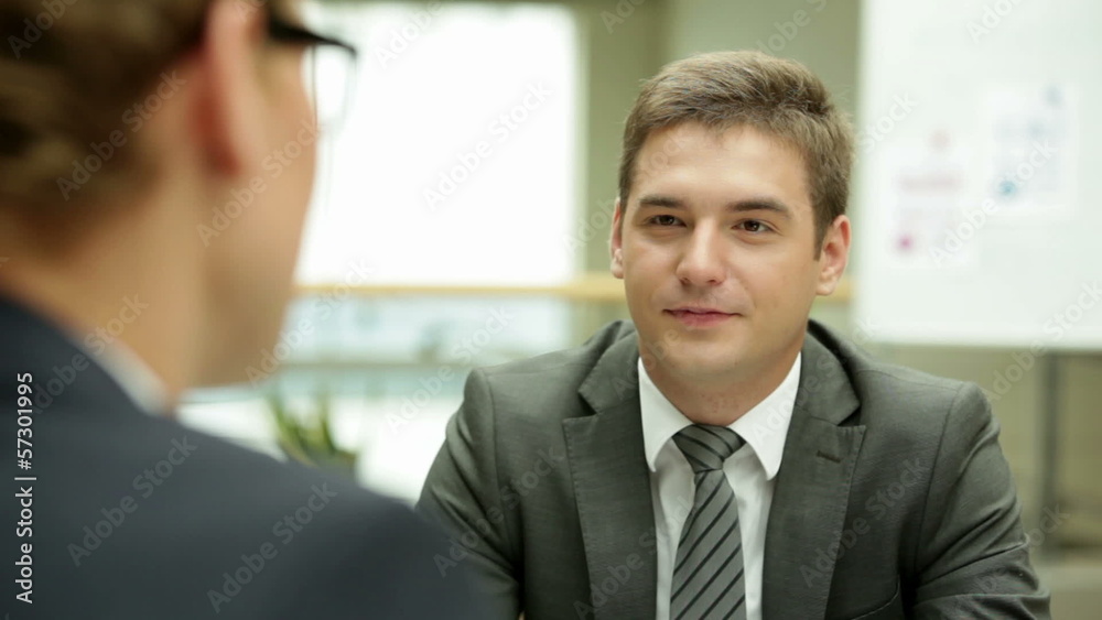 Businessman speaking to his colleague in the office Businessman speaking to his colleague in the office